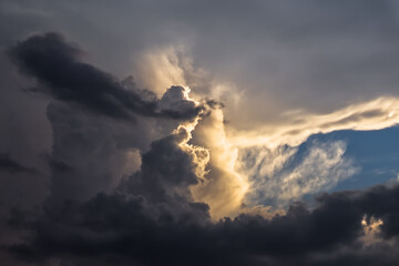 Dramatic sun coming through the vivid clouds.