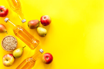Set of beer bottles with apple, pears, wheat from above