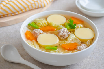 Clear soup with egg tofu and minced pork, Thai food.