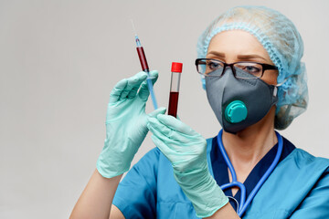 medical doctor nurse woman wearing protective mask and gloves - holding virus blood test tube and...