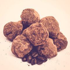 Mocha chocolate truffles with coffee beans, vintage toned