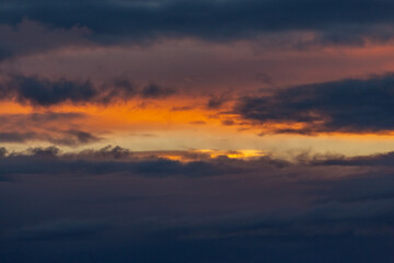 Fototapeta na wymiar Incredibly beautiful orange sunset. The sky before a thunderstorm