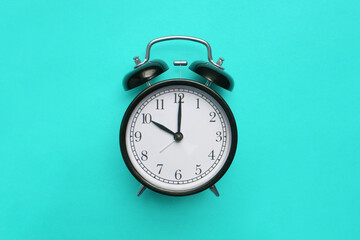 alarm clock on blue