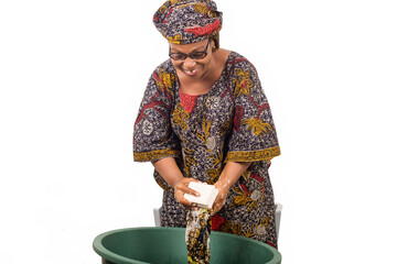 African woman washing clothes at home