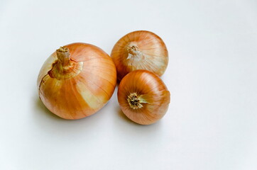 Group of whole ripe yellow onion on a white background, Sofia, Bulgaria  