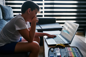 Child studying at home because of the coronavirus