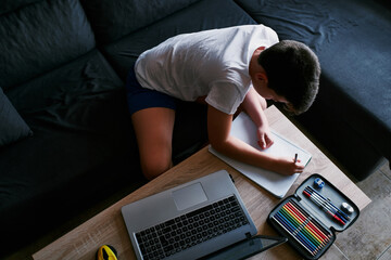 Child studying at home because of the coronavirus