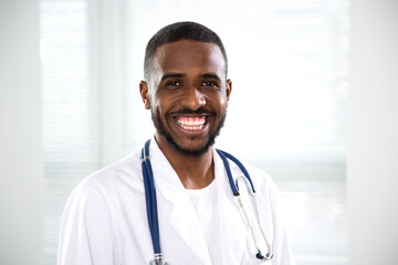 Сlose-up face of tired africanamerican doctor оn a background for your text.