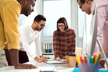 Fototapeta premium Multy-ethnic group of creative business people working with computer at office