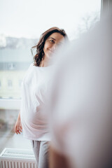 Close up woman and man in love snanding ia a room. Two people holding hands. Symbol sign sincere feelings, compassion, loved one, say sorry. Reliable person, trusted friend, true friendship concept