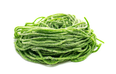 Fresh raw bio spaghetti pasta with spinach isolated on white background