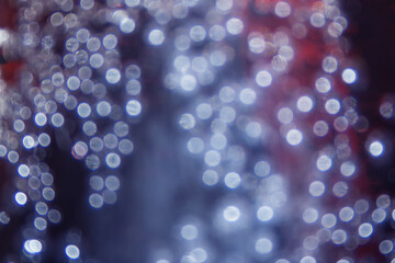 Abstract bokeh blurred light, blue red and white colors.