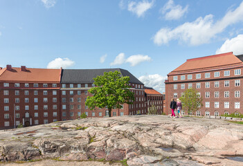 two girls walk on the roof Church of the Rock in Helsinki