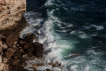 Ocean wave background breaking sea water rocky shore