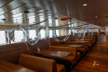 Interior of ferry boat with protective shield against corona virus pandemic 
