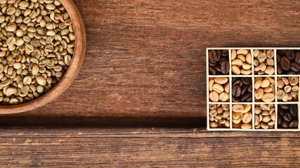 Close up of coffee beans in wooden bowl and coffee beans in a rectangular box for background