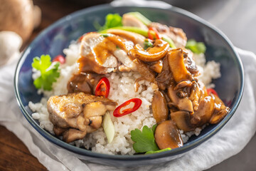 Chicken breasts with mushrooms, served with rice, chilli and parsley