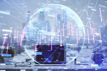 Stock market graph and table with computer background. Double exposure. Concept of financial analysis.