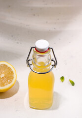Summer drink fermented kombucha lemonade in a bottle. Copy space. Vertical photo