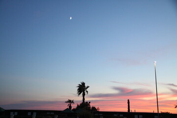 Pink sunset on the blue beach