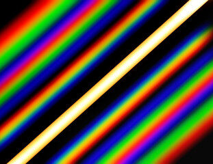 Linear LED luminaire observed through a phase diffraction grating. The photograph contains three diffraction orders from both sides. Source of warm white light with a color temperature of 3200K