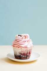 Sweet delicious birthday cupcake with pink strawberry cream. Stock food photography. Greeting card, copy space