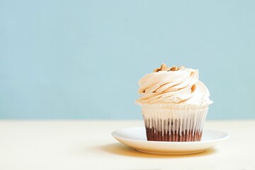 Delicious cupcake with vanilla cream on a blue background. Happy birthday greeting card and wallpaper for men, boys, friends
