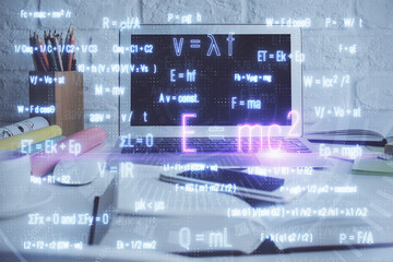 Desktop computer background and formula hologram writing. Double exposure. Education concept.