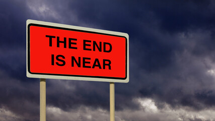 The end is near red warning sign with gathering dark storm clouds.
