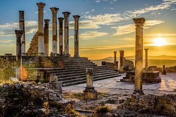 Volubilis is a partly excavated Berber city in Morocco situated near the city of Meknes, and commonly considered as the ancient capital of the kingdom of Mauretania. - obrazy, fototapety, plakaty