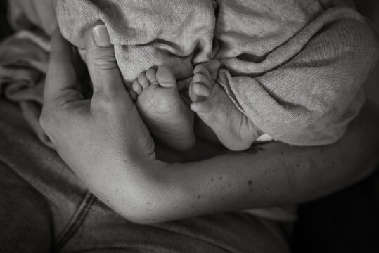 Black and white photo of twin baby feet