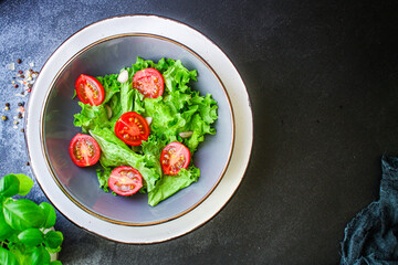 salad vegetables, lettuce and tomato Menu concept. food background top view copy space for text healthy eating keto or paleo diet 