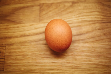 Egg on wooden table.