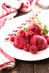 ice cream with raspberry in plate