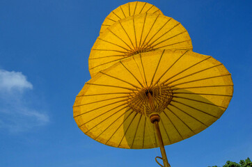 Three level of yellow and bamboo frame umbrellas