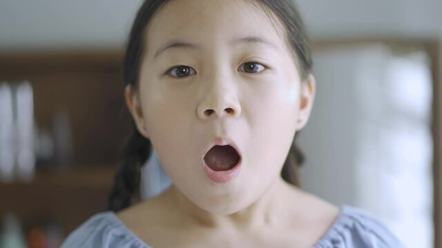 Asian little girl scared expression, close up
