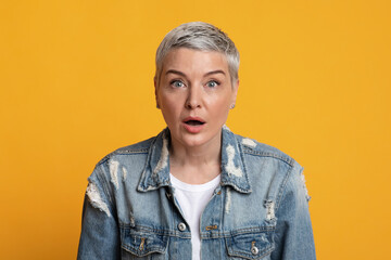 No way. Portrait of shocked middle aged woman opened mouth in amazement