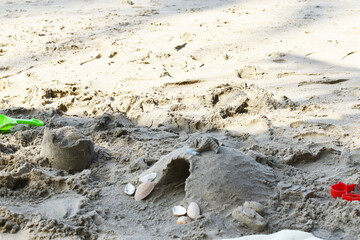sandcastle made from sea sand and shells