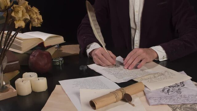 Writer Concludes and Signs the Manuscript. Medieval writer rereads text on a sheet of old paper and appends with a pen at the bottom a few lines