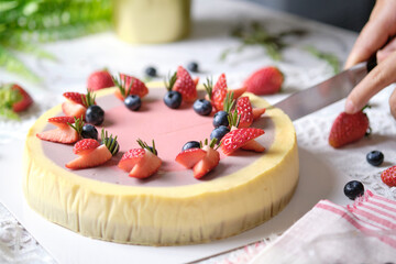 Low Fat Mousse Yogurt Strawberry and Raspberry Cheesecake set on cafe table.  Gluten Free Low-Carb Healthy Dessert.