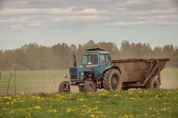 tractor in a field with a trailer