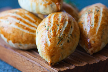 Turkish mini hand pies acma with cheese and herbs.