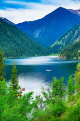 Fascinating landscape of a mountain river flowing into the lake.