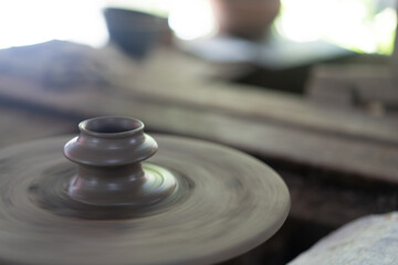 terracotta clay pot on the wheel
