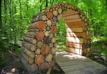 Wooden arch in a forest road in the forest of Gisselfeld Klosters. Denmark
