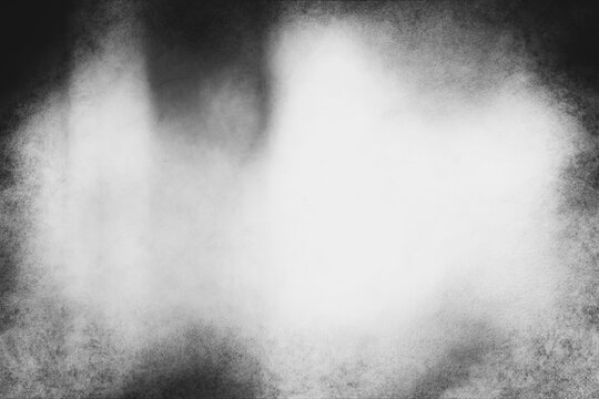 Black and white eerie grunge texture or background with space for text or image.