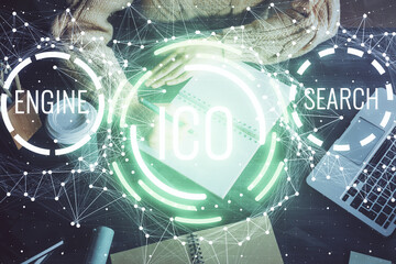 Cryptocurrency hologram over hands taking notes background. Concept of blockchain. Multi exposure