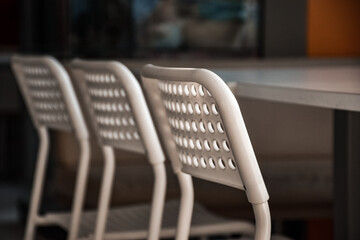 white chairs with holes