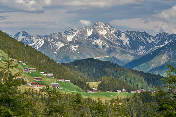 Landscape of Pokut Plateau with snowy mountains, clouds and green nature. Taken from Sal Plateau, Kackar Mountains, Rize, Black Sea / Karadeniz region of Turkey