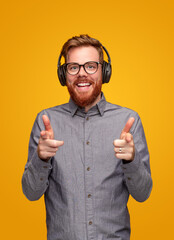 Cheerful man listening to music with headphones © kegfire